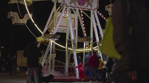Hamburg , Hamburg / Germany - 12 30 2019: Ferris wheel at a Christmas market in Hamburg, Germany, in Dec 2019 with crowds