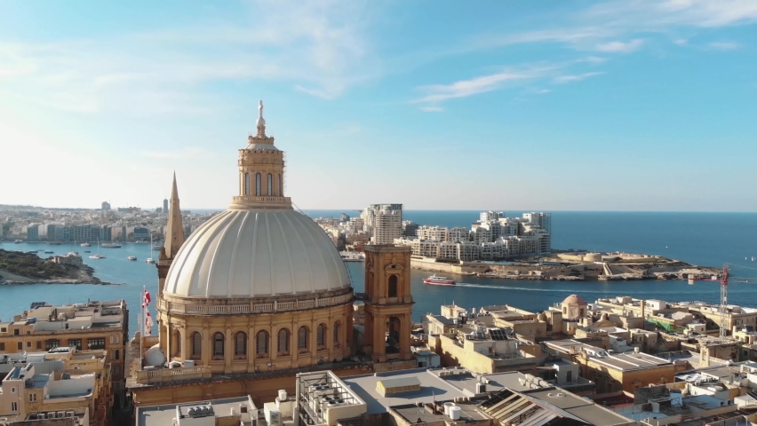 Carmelite Church dome with cityscape in background. Valletta, Malta. Aerial circling shot | Shutterstock HD Video #1062586348