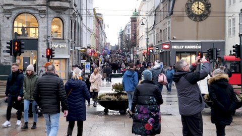 Oslo / Norway - 01 18 2020: Oslo, Norway January 2020 - crowds of people on Main Street at Karl Johans Gate