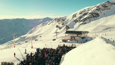 Ski festival at popular music bar on slopes, aerial view