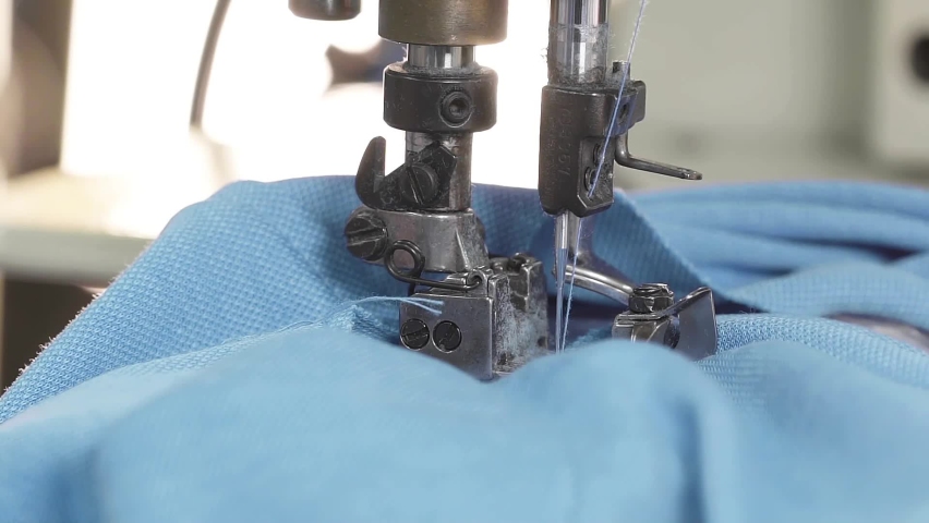 Closeup shot of sewing machine making patterns on cloth. Cloth manufacturing plant.Machine stitching clothes. | Shutterstock HD Video #1062598951