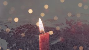 Digital composition of burning candle and spots of light against snow landscape. digital composite video concept