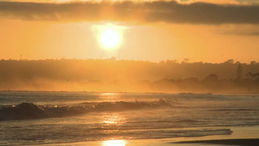 Gold colored sunset over Pacific Ocean in San Diego, California, U.S.