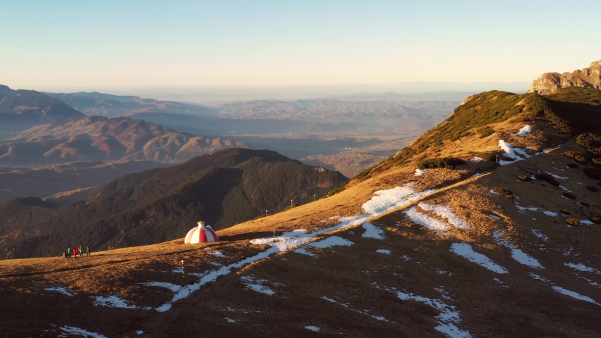 Drone 4k clip of Batrana mountain refuge high at 2170m in Bucegi Mountains, Romania, on a beautiful autumn day	
 | Shutterstock HD Video #1062606484