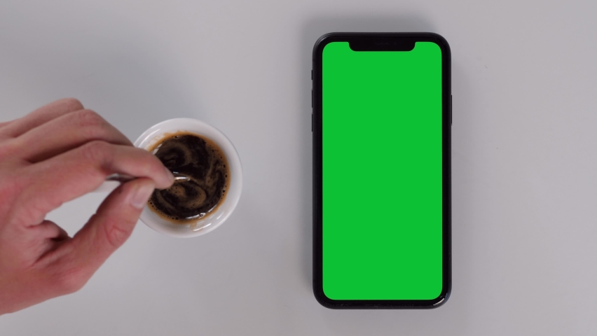 Italy - November 2020: Having a Coffee while Watching a Smartphone with Green Screen | Shutterstock HD Video #1062615088