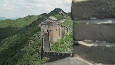 Great Wall of China - Jinshanling Section - Dolly to Reveal Empty Wall and Watchtower on Green Mountaintop