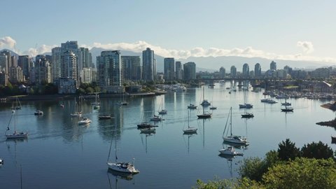 Stunning Drone Aerial Shot Over the Vancouver Marina, Moving Closer to the Cityscape Skyscrapers Canada.