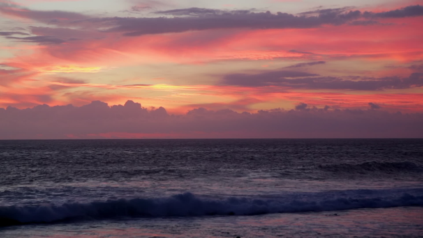 Colored sunset over Reunion Island seen from Grand Anse beach