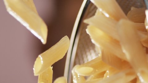 Pasta in the pan is mixed.Macro, 4K, Phantom Camera, Super Close-up.Video for the vertical story.