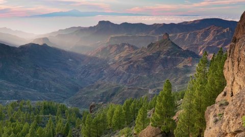 Nature of Gran Canaria island. Sunset view from Roque Nublo point. Tenerife island visible in the background. Canary, Spain
