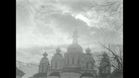 
churches in Kiev. filmed with a vintage 16mm film camera. old newsreels. domes of churches against the sky.