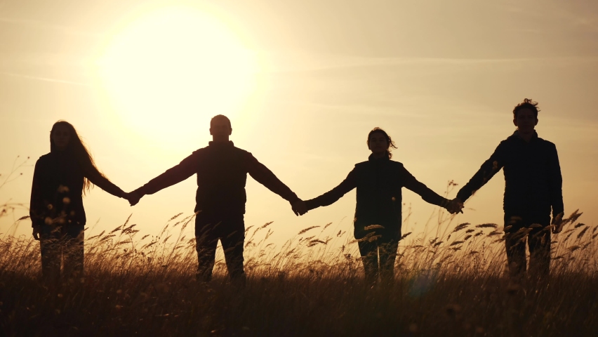 teamwork. team community hold hands together silhouette at sunset unity. group of people hands. teamwork a workers carry out one mission go the goal business. team in the company working partnership Royalty-Free Stock Footage #1062634447