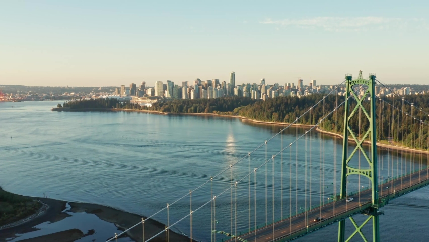 Drone Aerial Shot flying towards Vancouver cityscape passing the Lions Gate Bridge Royalty-Free Stock Footage #1062640246