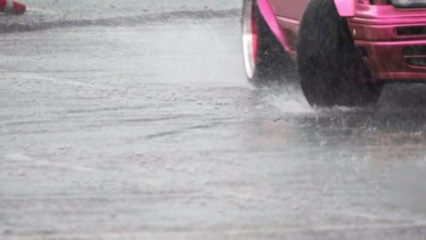Car skidding on a slippery wet road in rainy day
