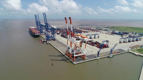 Hai Phong, Vietnam 02 2020: Aerial view, top view cargo ship port in the export, import business and logistics international goods. Logistics and transportation of Container Cargo ship working 