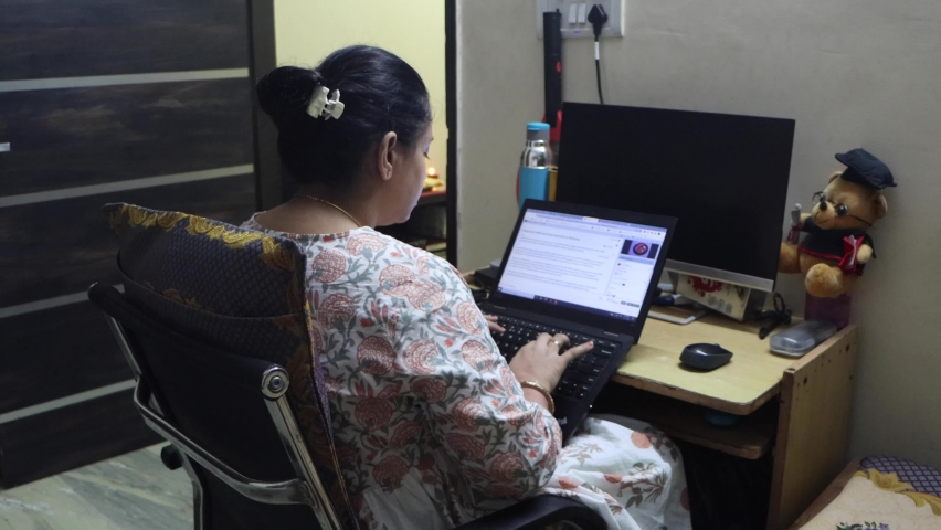 November 12, 2020. Delhi, India. Young Indian Woman (in her early 30s) working from home on her laptop during late evening.