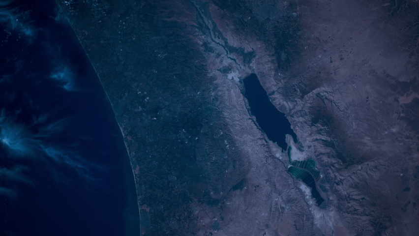 Satellite aerial view sunrise animation on Dead sea, salt lake in middle east area. Images furnished by Nasa Royalty-Free Stock Footage #1062657541