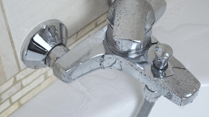 Plumber Fixing Repairing A Leaky Stock, Bathtub Faucet Wrench