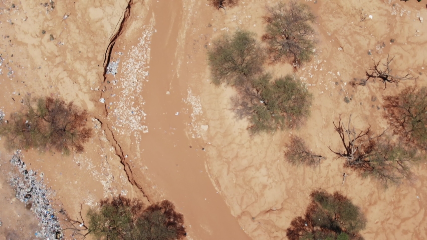 Aerial footage of a dry riverbed in Puntland, Somalia.  Royalty-Free Stock Footage #1062681712