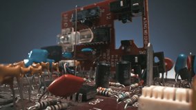 Dollying-out macro footage of orange electronic board background with vintage old components - Powered by Shutterstock - Get 15% off with code: PIKWIZARD15