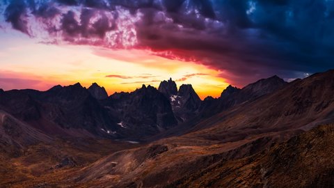 Cinemagraph Continuous Loop Animation. Aerial View of Scenic Landscape and Mountains in Canadian Nature. Colorful Twilight Sky Artistic Render. Taken in Tombstone Territorial Park, Yukon, Canada.