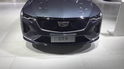 Shanghai, China - Sep 30, 2020: Cadillac booth showroom in Shanghai Pudong International Auto Show. Car exhibition and vehicle promotion. Auto business and economy staff with mask coronavirus period