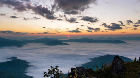 Time lapse of sunrise and mist in morning at Doi pha tang, Chiang rai, Thailand