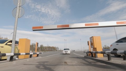 Checkpoint post with automatic road barriers. Passage of cars through automatic gates. Domodedovo, Russia - October 10, 2020.