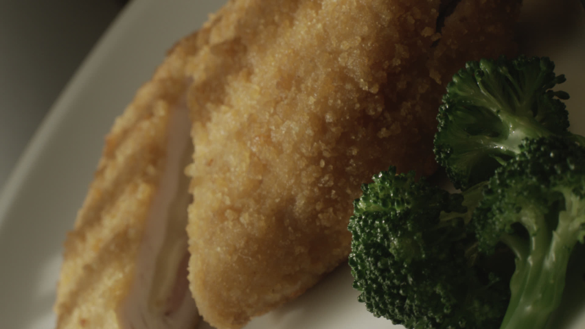 Close-up of an appetizing fragrant cut of cordon bleu with cheese and beef
