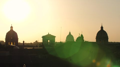 Panoramic view of Rome cityscape from campidoglio terrace at sunset. Seagulls, landmarks, domes of Rome, Italy.