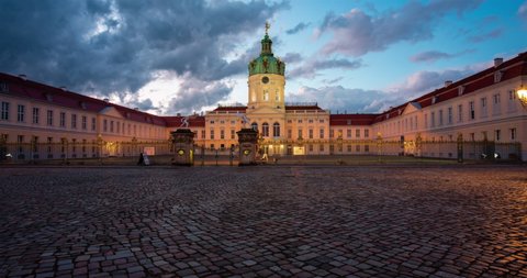 Sunset hyper lapse of Schloss Charlottenburg in Berlin, Germany with dramatic clouds in the sky
