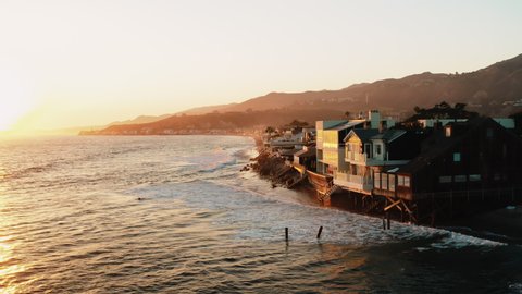 Malibu Colony Beach. Real Estate. Cinematic aerial shots of Malibu Communities. Beautiful sunset and ocean view /  Malibu, California, US