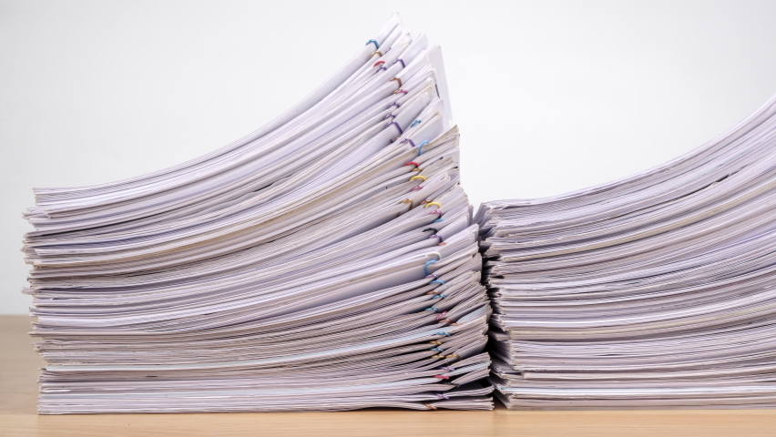 Stop motion animation Stacks overload document paper files on office desk, Business concept. Dolly shot. | Shutterstock HD Video #1062737323