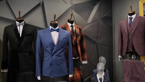 Luxury men fashion suits displaying on mannequins at store