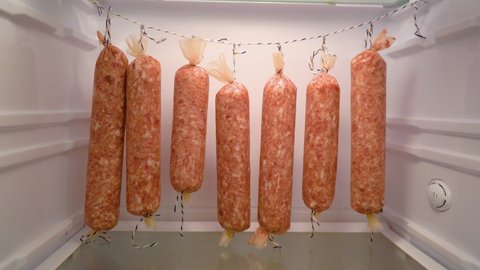 homemade sausage hanging in the fridge