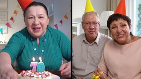 Celebration online. Mature couple wishing an elderly woman a happy birthday using a video call. Home quarantine, social distancing, self isolation.