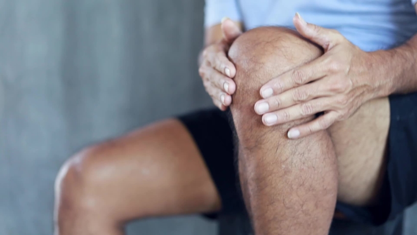 man with knee pain, hand massaging his painful knee. Health care and medical concept. health problems Royalty-Free Stock Footage #1062757966