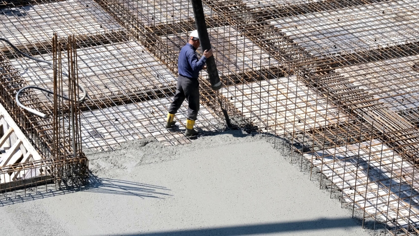 Workers pouring concrete at the construction site Royalty-Free Stock Footage #1062758695