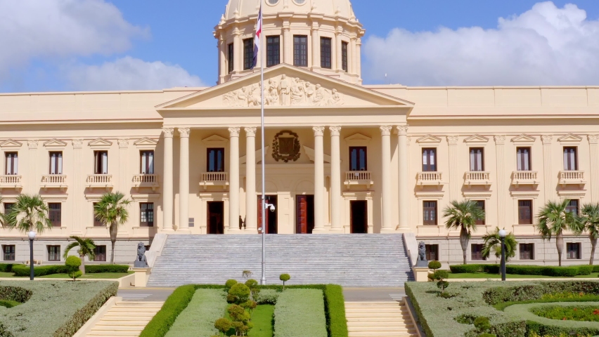 Ascent shot with drone of the Presidential Palace of
Dominican Republic, overlooking the flagpole of the national flag