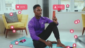 Portrait African american young man after training have video call smile feel happy at home. Social media icons with like comment follower counter in light room. Chatting online. Slow motion - Powered by Shutterstock - Get 15% off with code: PIKWIZARD15