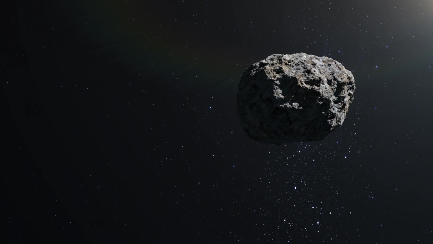 Asteroid in space. The asteroid flies and rotates slowly. Starry sky. 4K. Stars twinkle. 3d rendering. Royalty-Free Stock Footage #1062771154