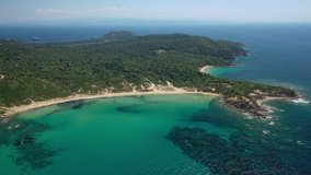 Aerial drone video of paradise twin beaches of Mandraki and Elia in island of Skiathos island, Sporades, Greece