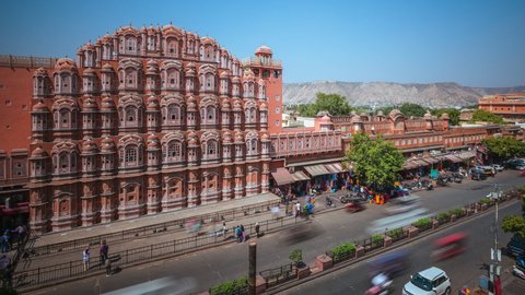 Time lapse view traffic in front of historical landmark Hawa Mahal aka Palace of the Winds located in the Pink City of Jaipur in Rajasthan, India.