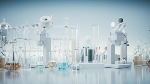 Laboratory equipment. Vaccine production in the laboratory. Chemical laboratory glassware. Lab graduated glassware filled with different color reagents. 