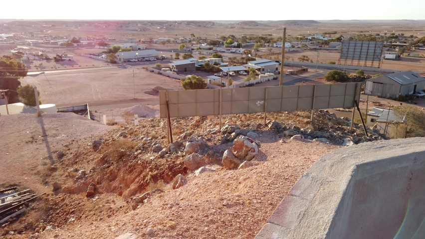 Night banner panorama of Coober Pedy opal mining town in Australia at twilight. Opal capital town of the world in South Australia. Breakaways Reserve