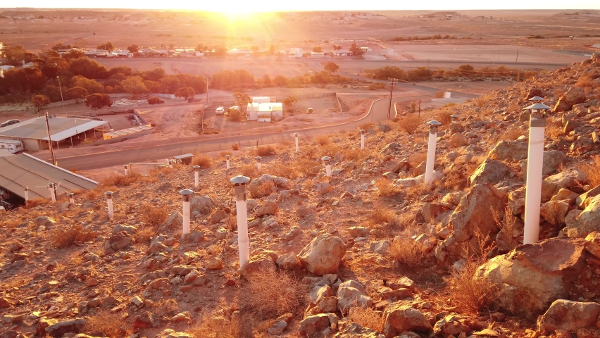 SUNSET aerial view of Coober Pedy town in Australia at twilight. Opal capital town of the world in South Australia