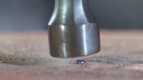 Supper Slow Motion Detail Shot of Hammering a Nail at 1000 fps.