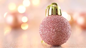 Rose gold glitter Christmas ornament with blinking lights on light theme - Powered by Shutterstock - Get 15% off with code: PIKWIZARD15