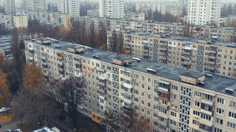 Dormitory district (bedroom community) of the Soviet architecture on a autumn foggy day. Residential apartment buildings (block of flats) of the Soviet period. Aerial view
