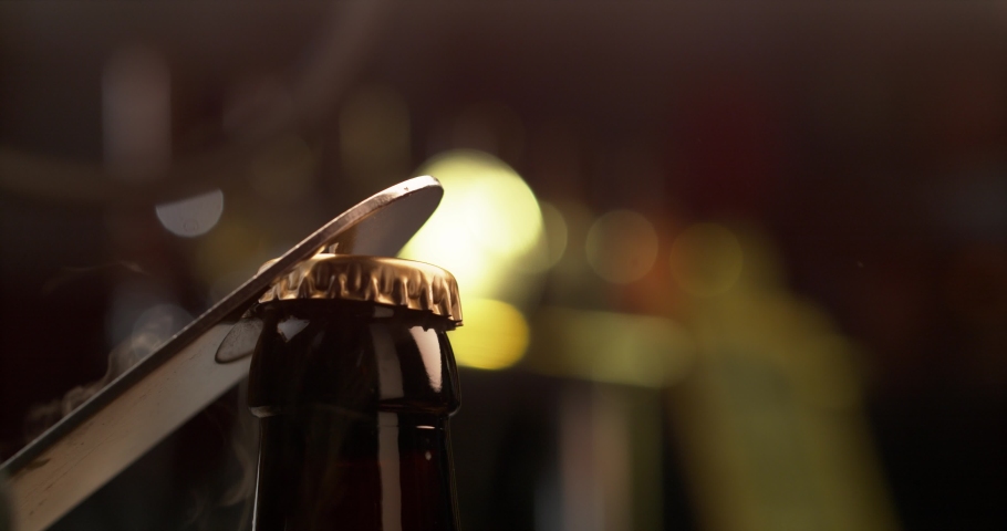 CLOSE UP: Opening a brown beer bottle with an old opener Super slow motion. Phantom Flex 1000fps. | Shutterstock HD Video #1062812560